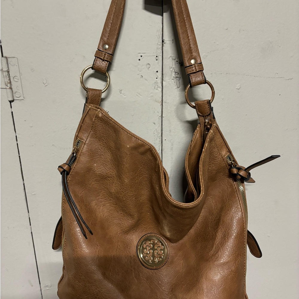Brown Leather Hobo Bag with Slouchy Design and Metal Hardware